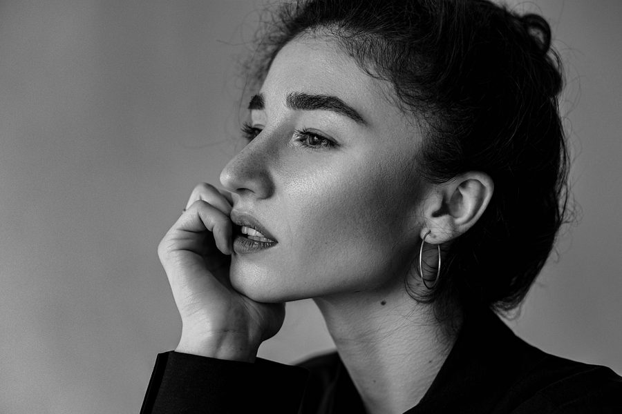 Elegant studio portrait with soft natural light by Anna Zulian in Lausanne